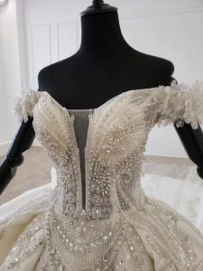 Off shoulder full beaded luxurious empire wedding dress - Image 5